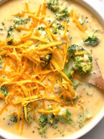 overhead shot of broccoli cheddar soup in bowl.