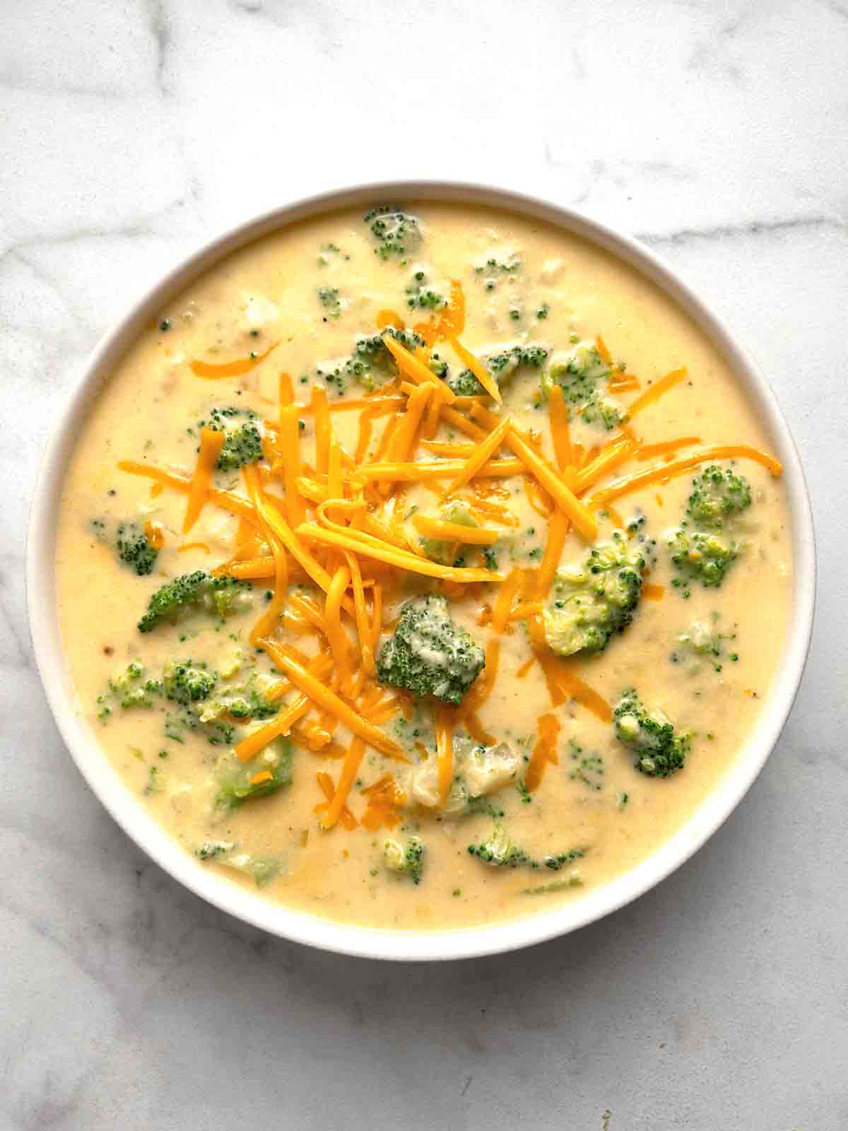 overhead shot of broccoli cheddar soup in bowl.