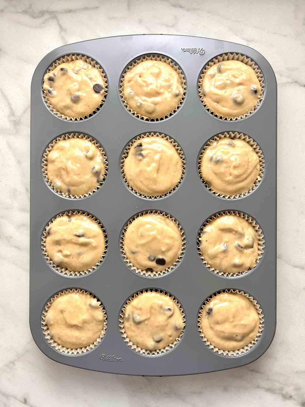 batter divided into muffin liners.