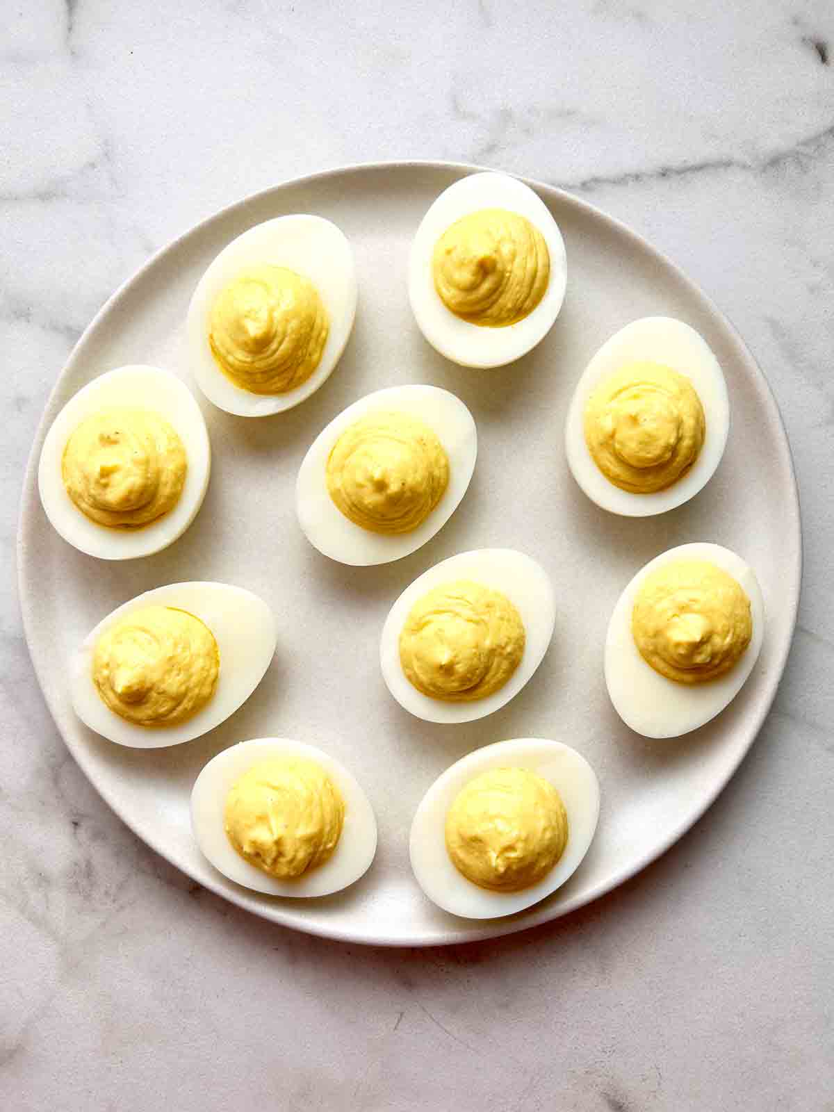 yolk mixture piped into egg whites.