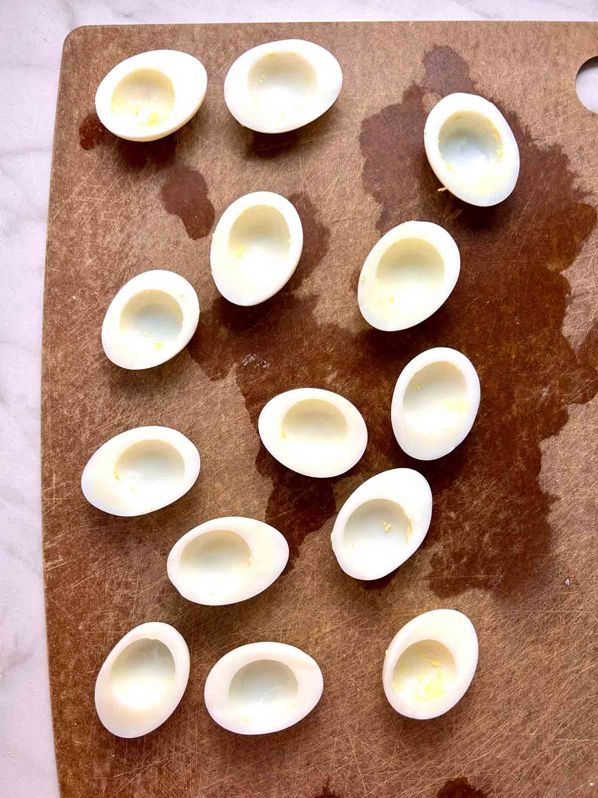 egg whites with yolks scooped out.