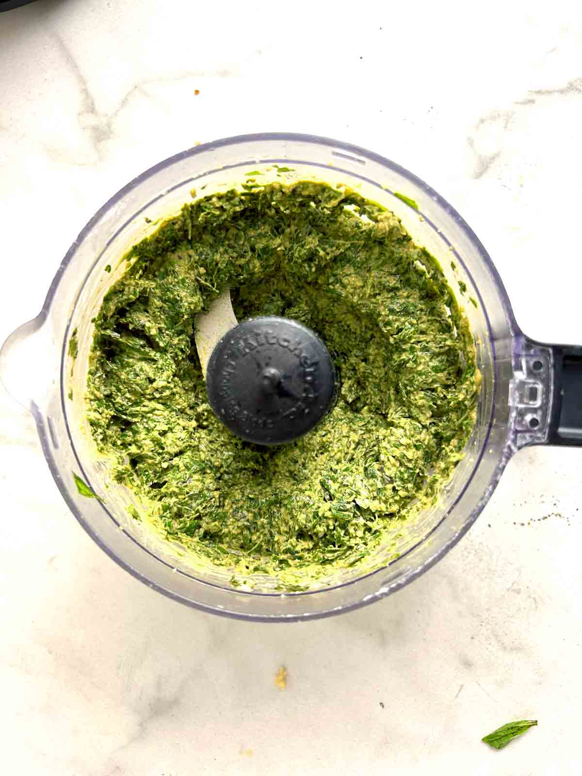 basil leaves blended into pine nuts and garlic.