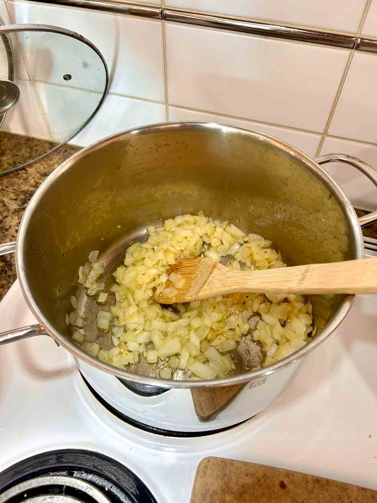 onions and garlic cooking in pot.