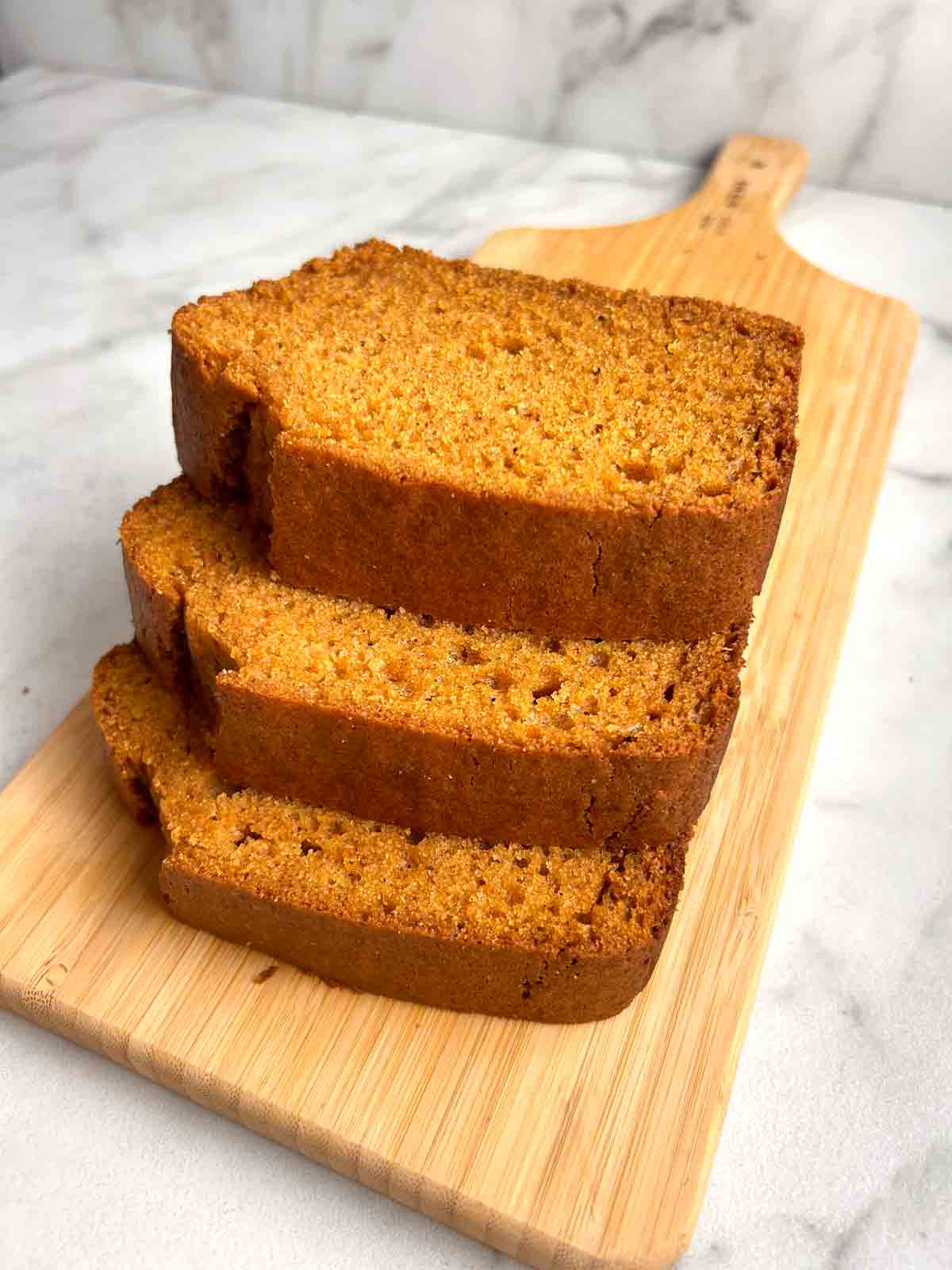 3 slices of sweet potato bread stacked on top of each other.