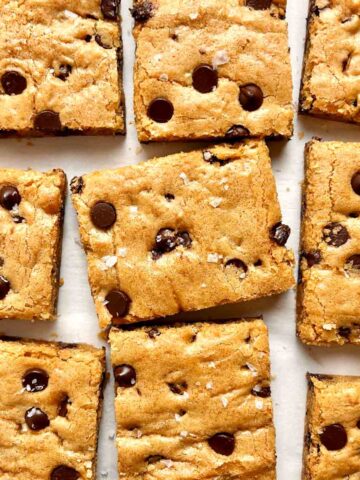 overhead shot of slices of blondies on parchment paper.