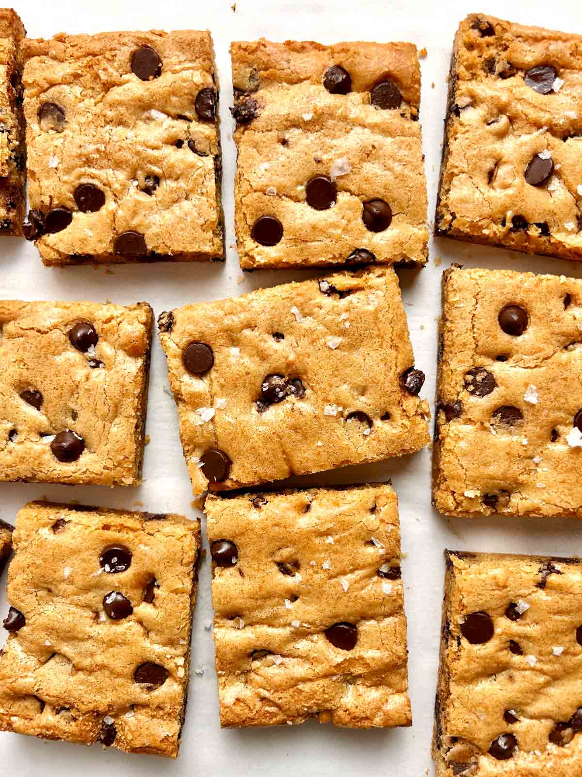 overhead shot of slices of blondies on parchment paper.