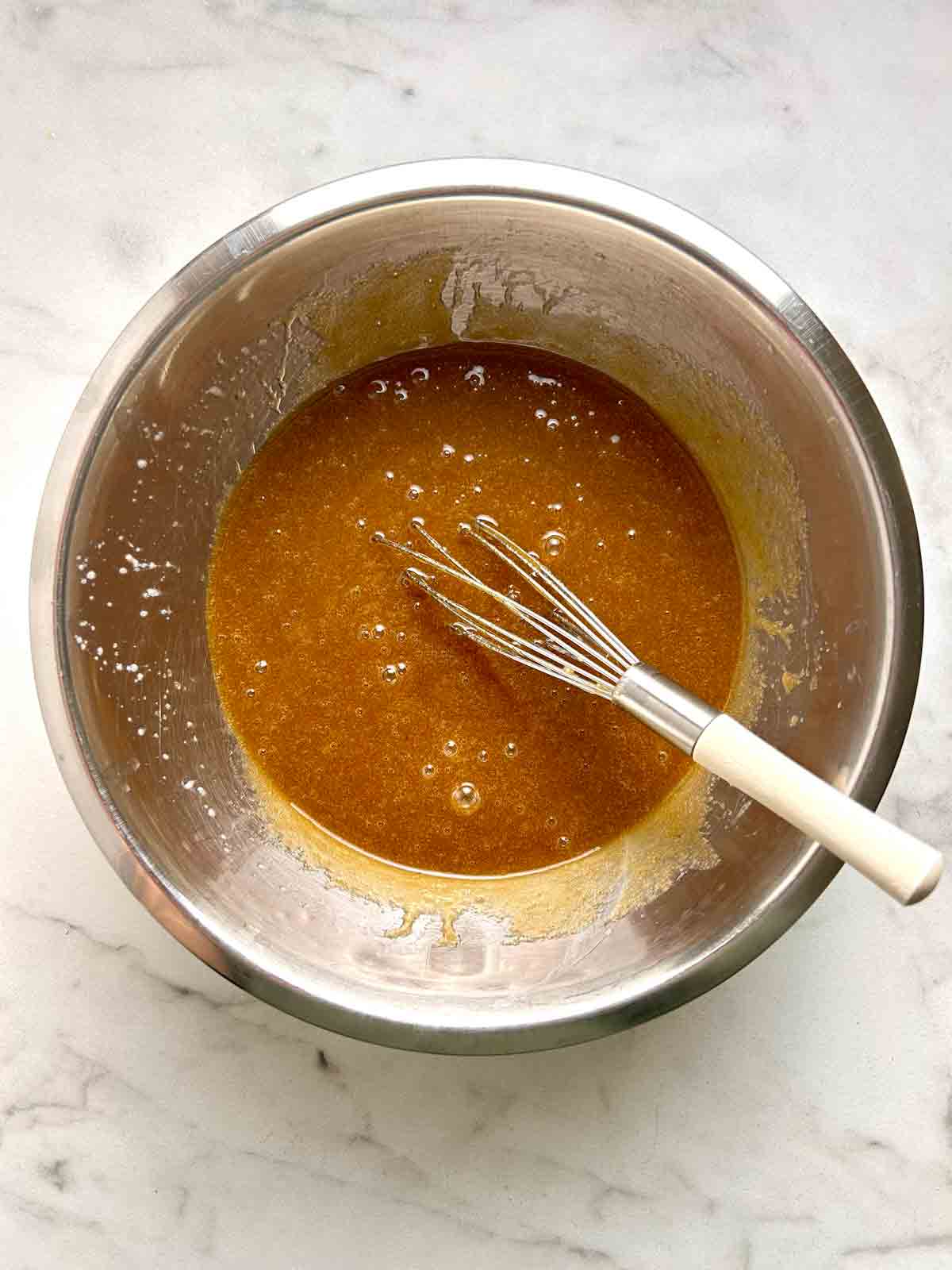 wet mixture whisked in bowl.