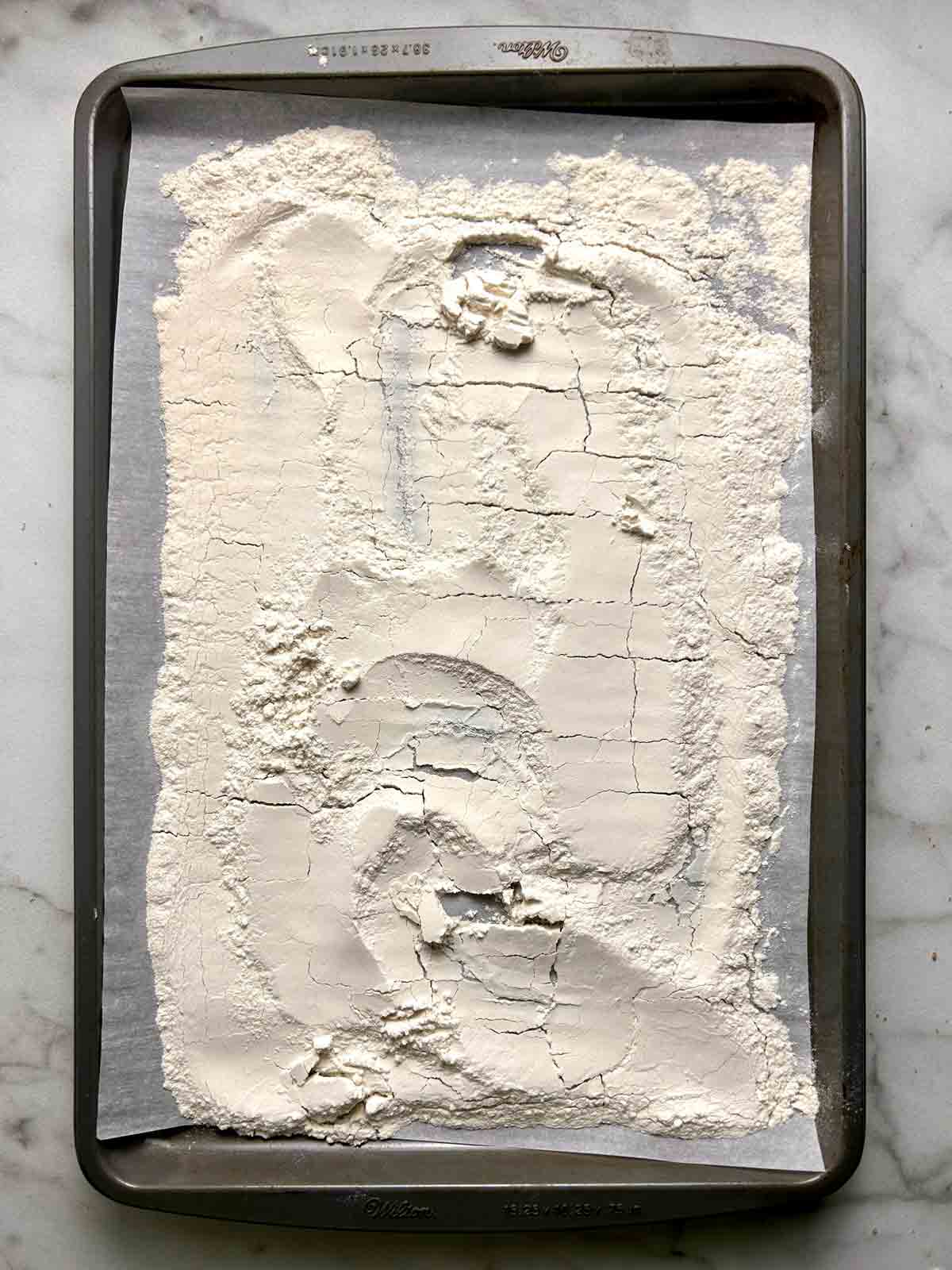 flour spread on baking pan.
