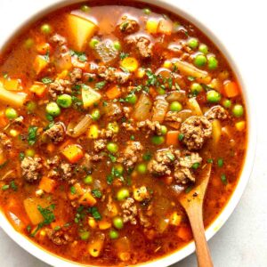 bowl of hamburger soup with spoon in it.