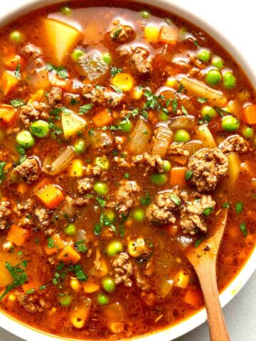 bowl of hamburger soup with spoon in it.