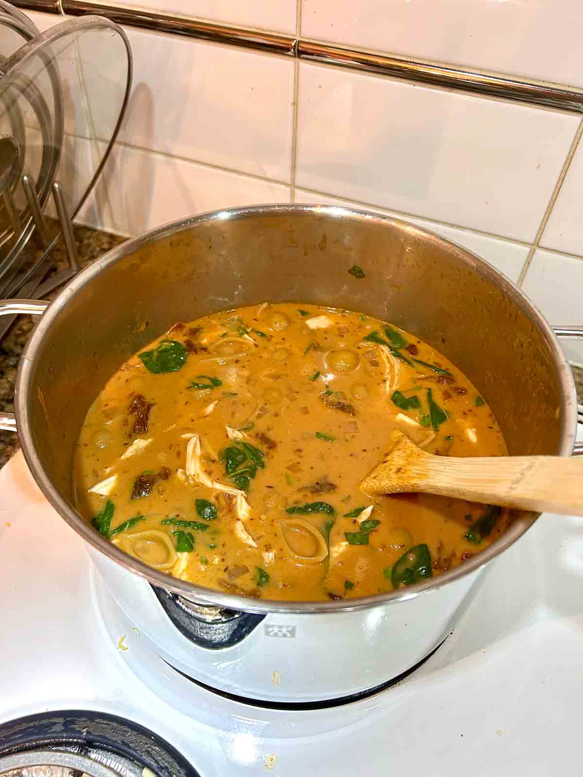 chicken, cream, spinach, and cheese added to pot.