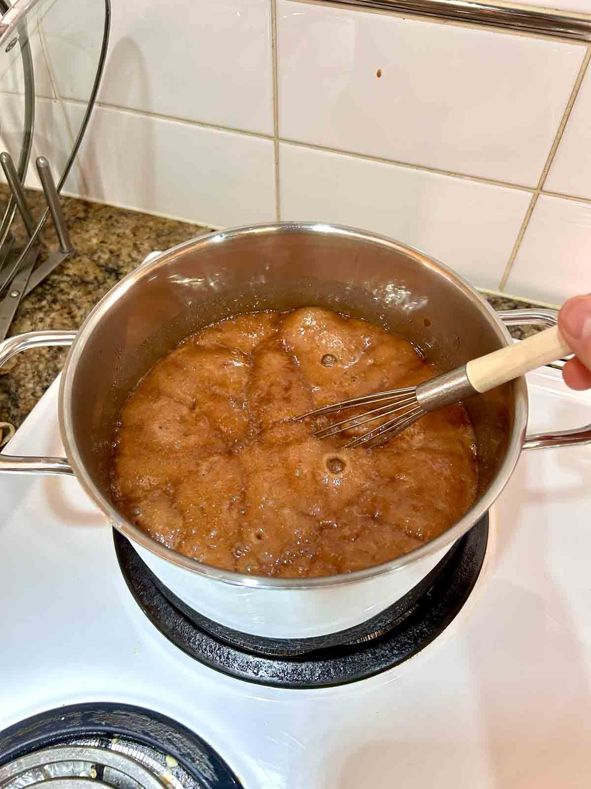 cocoa powder mixture boiling in pot.