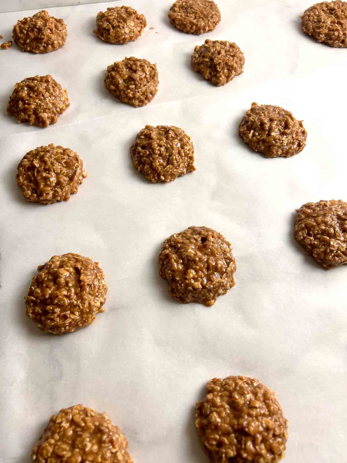 spoonfuls of batter dropped onto parchment paper.