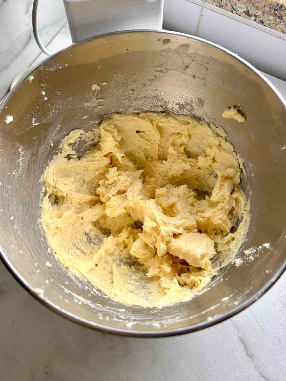 egg mixed into creamed butter and sugar mixture.