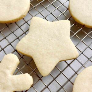 close up of star shaped sugar cookie on cookie rack.