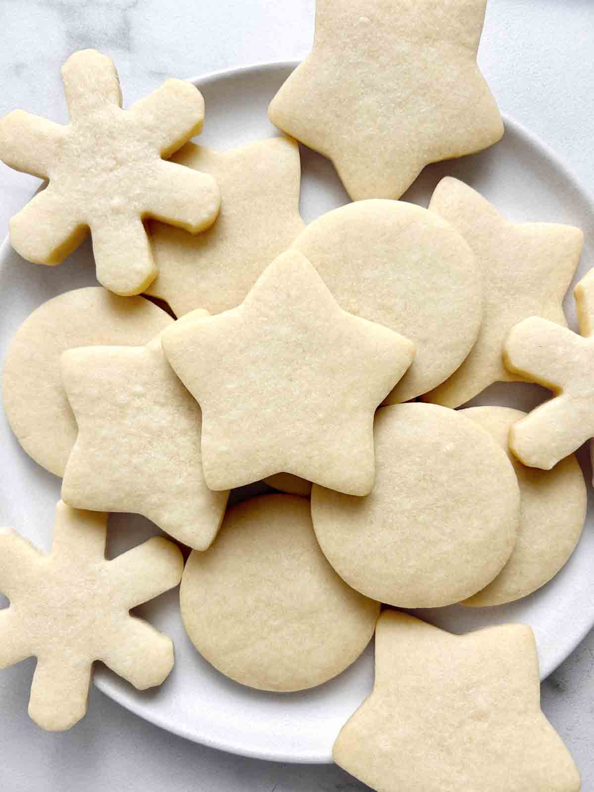 assortment of sugar cookies on plate.