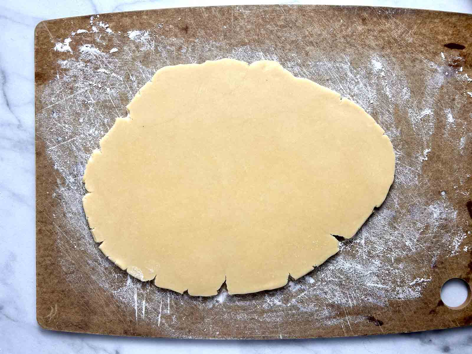 rolled out dough on floured cutting board.