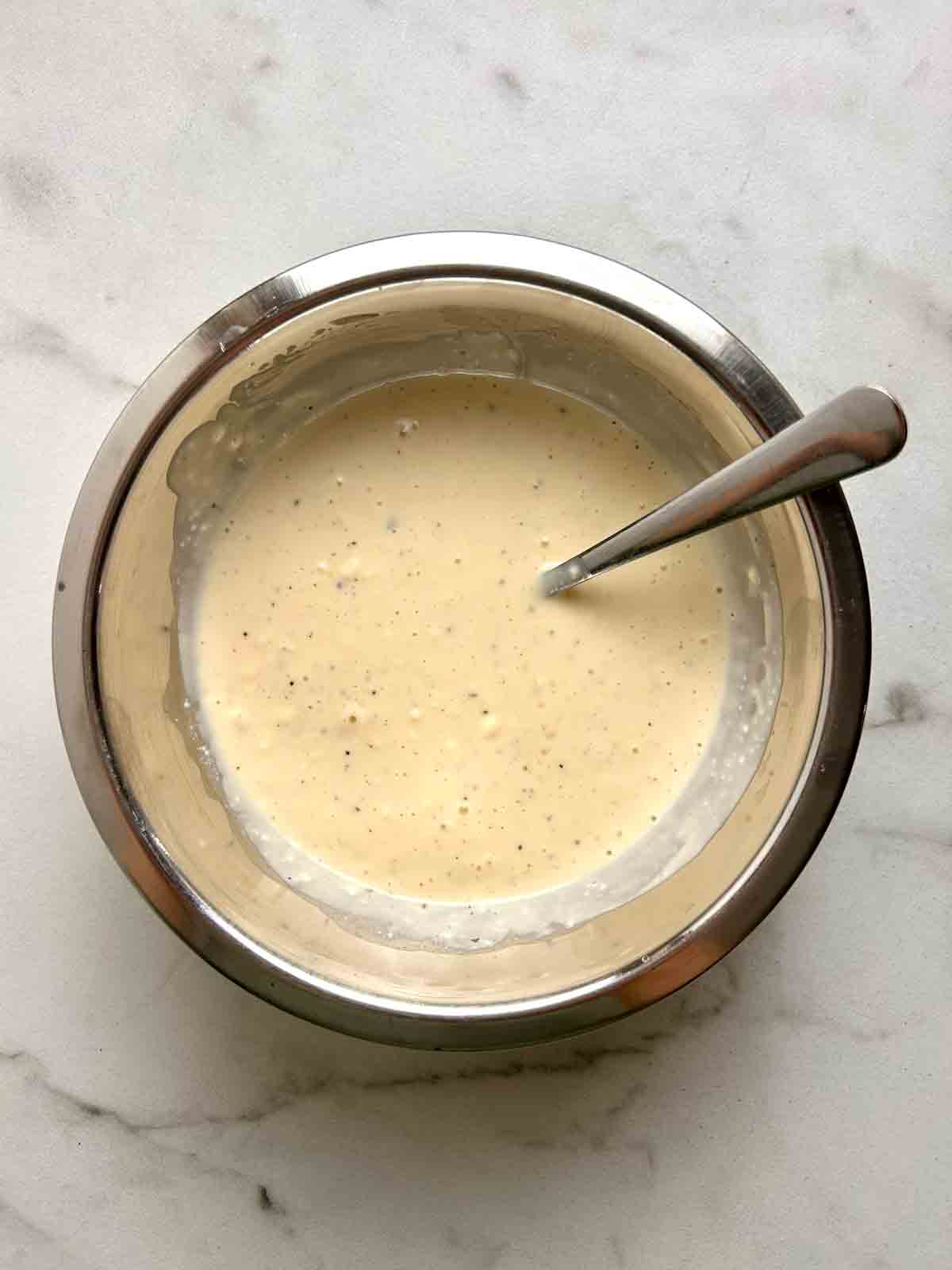 dressing mixed in bowl.