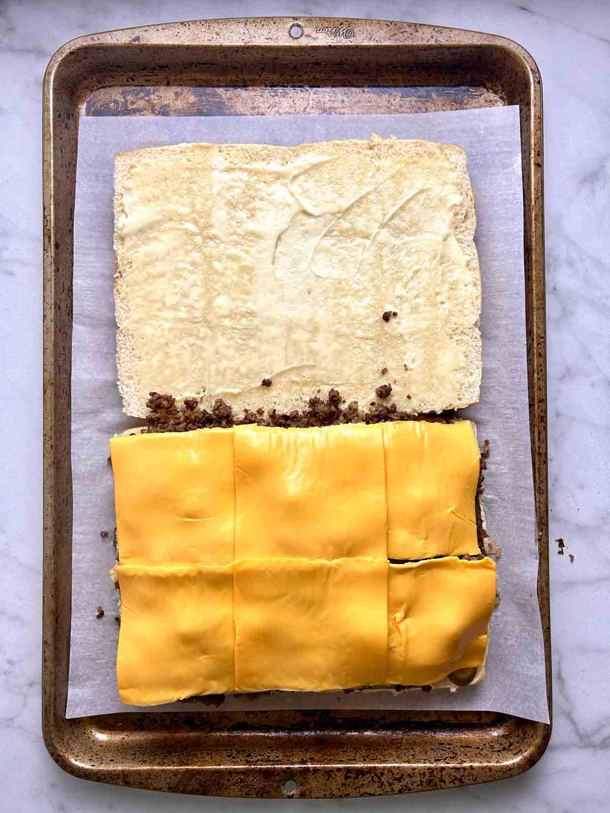 beef and cheese added to sliders.