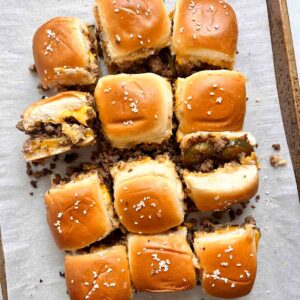 cheeseburger sliders on baking sheet.