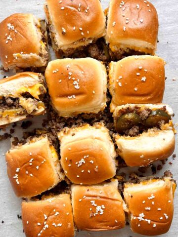 cheeseburger sliders on baking sheet.