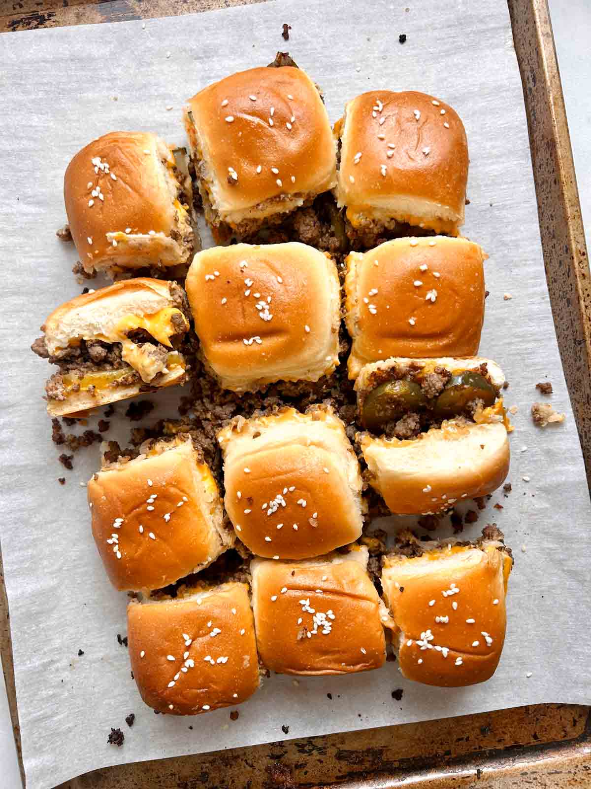 cheeseburger sliders on baking sheet.
