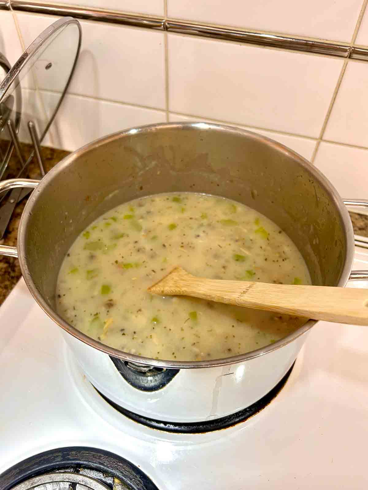 chicken broth, seasonings, potatoes, and clam juice added.