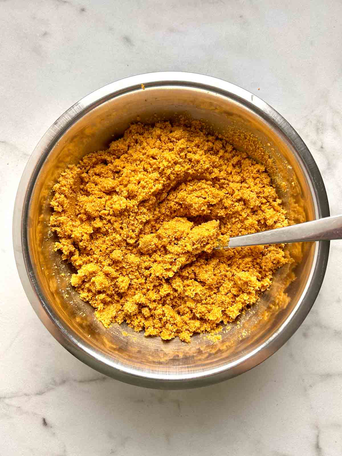 graham cracker crumb mixture mixed in bowl.