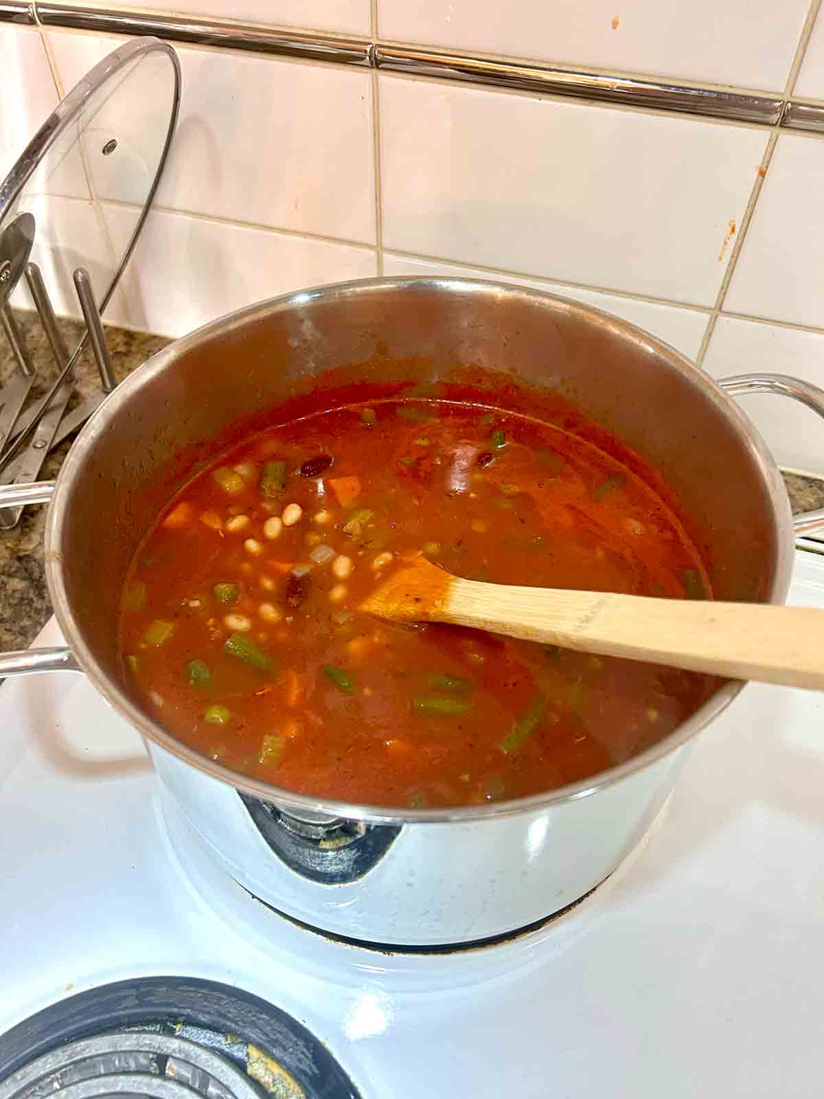broth, beans, green beans, and zucchini added to soup.
