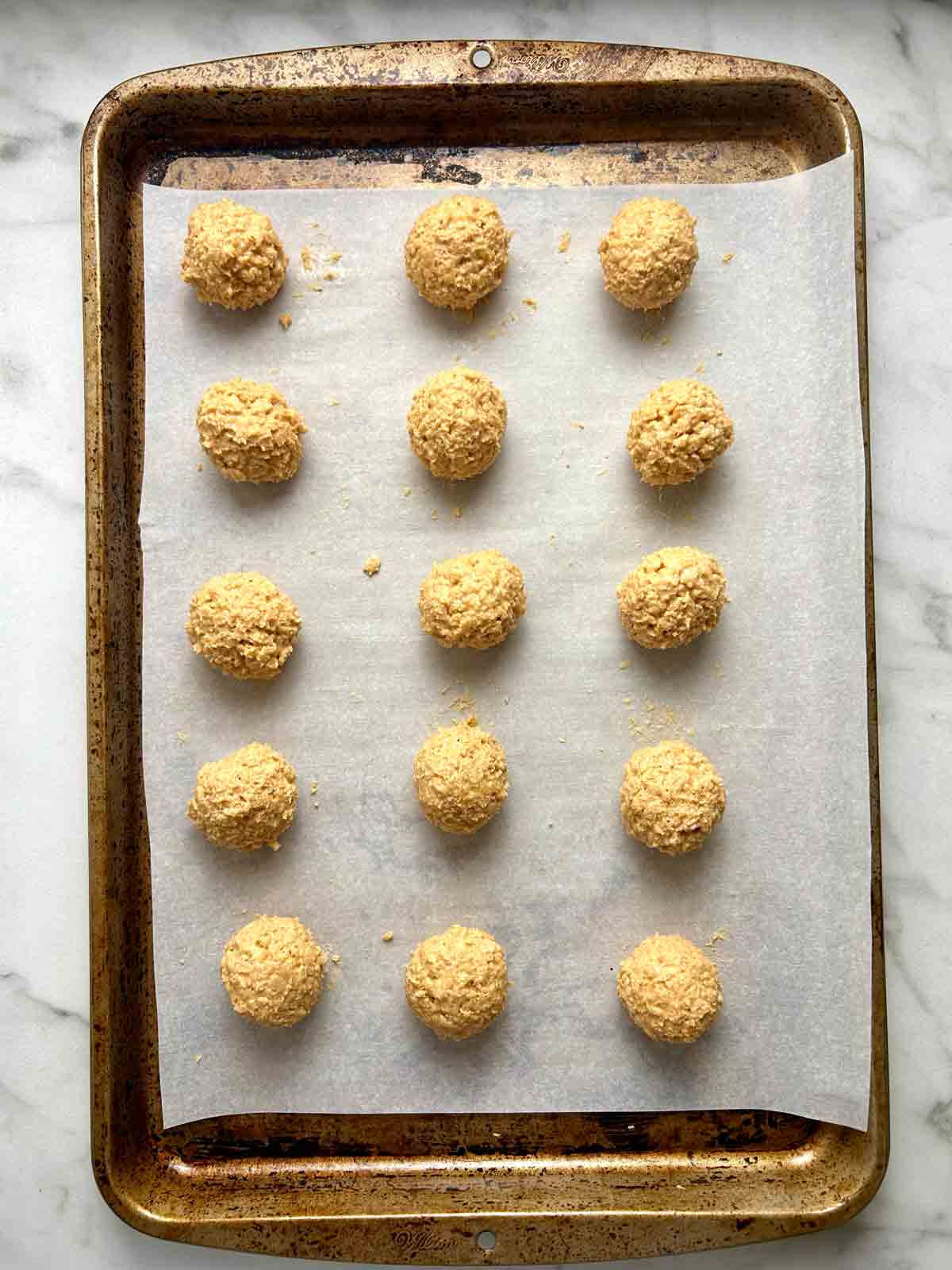 mixture rolled into balls and arranged on baking sheet.