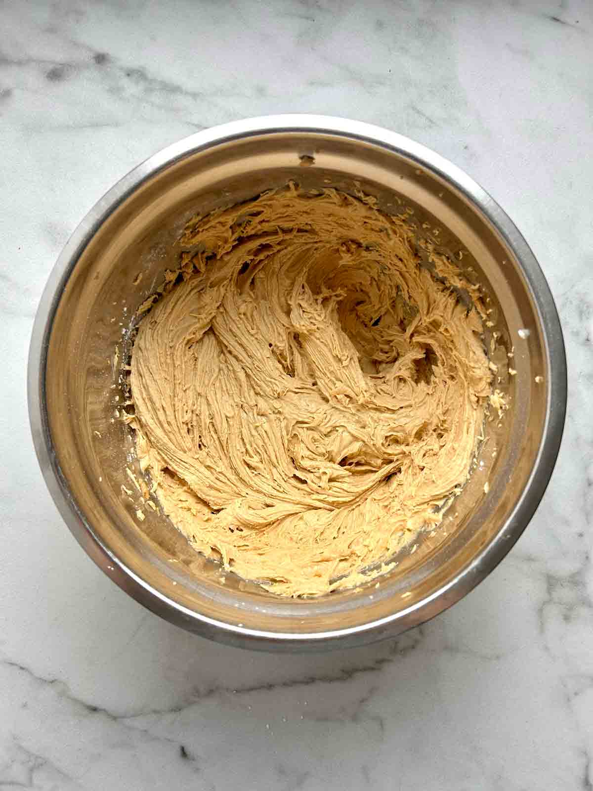 peanut butter mixture whisked in bowl.