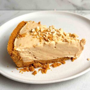slice of peanut butter pie on plate.