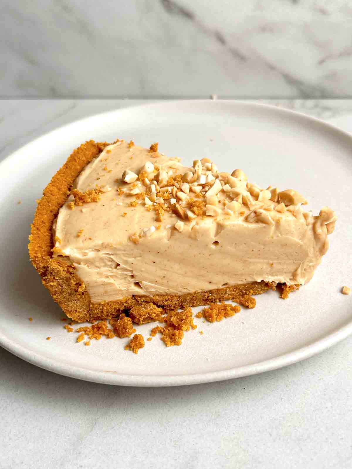 slice of peanut butter pie on plate.