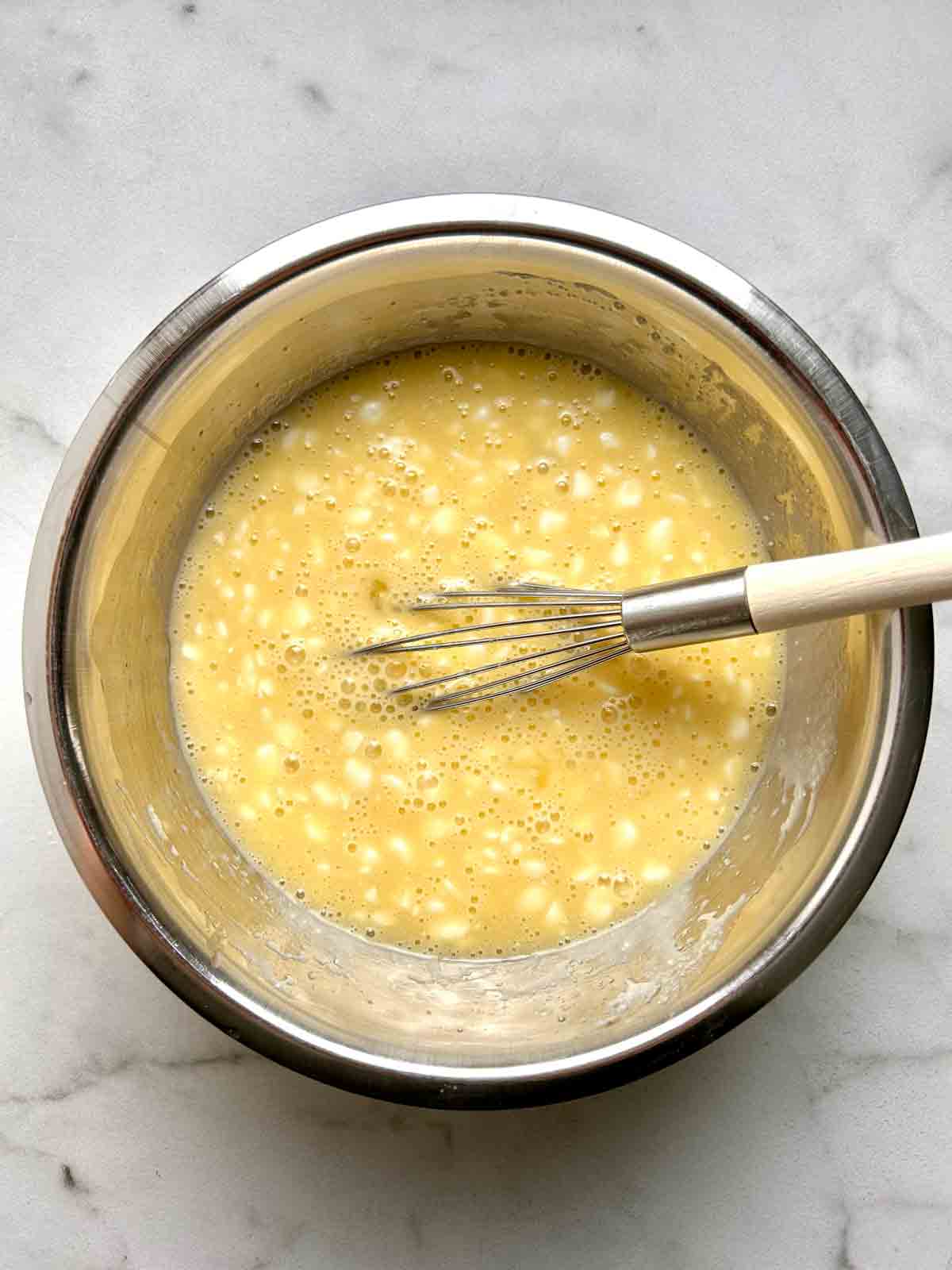 wet mixture whisked in bowl.