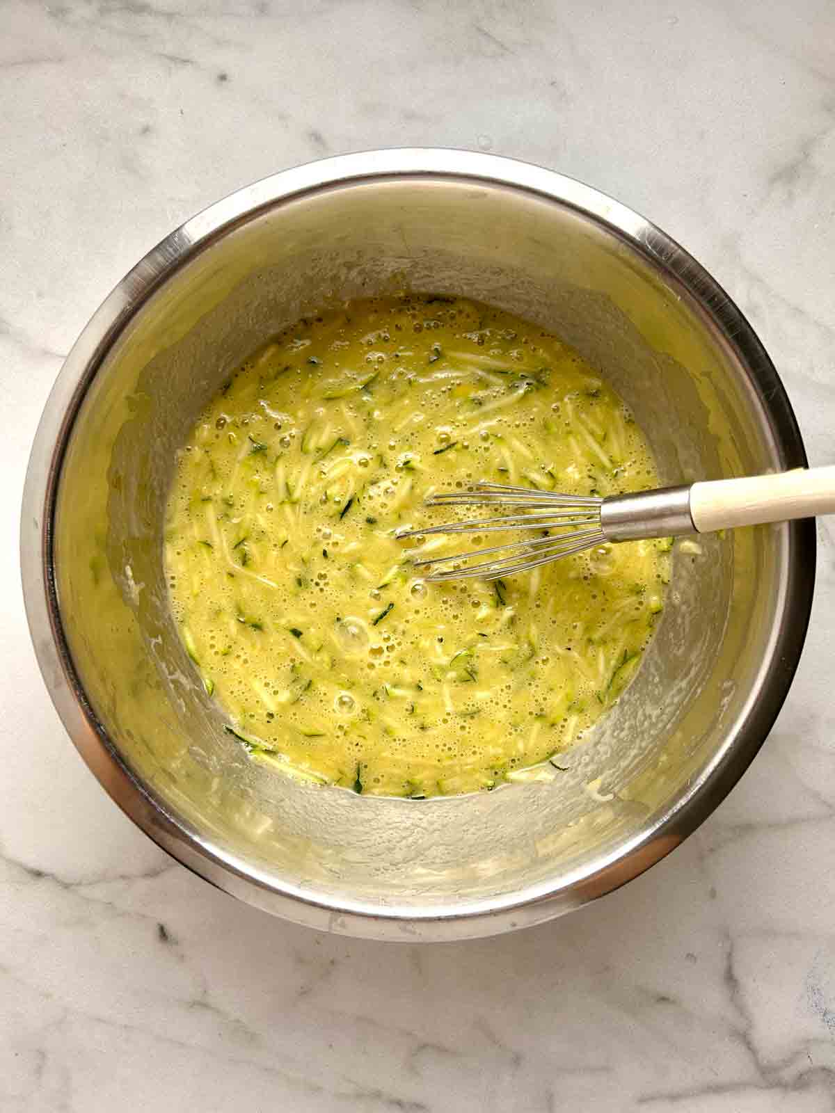 wet mixture whisked in bowl.