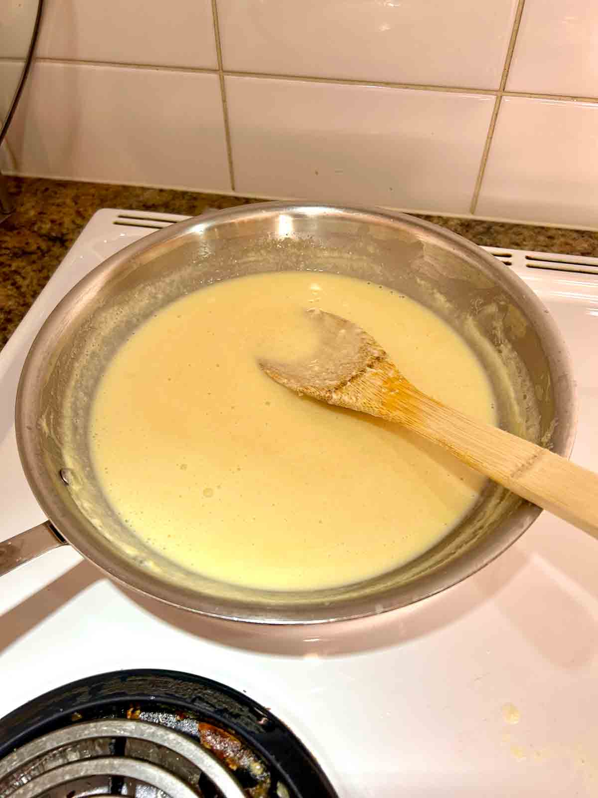Parmesan cheese stirred into sauce.