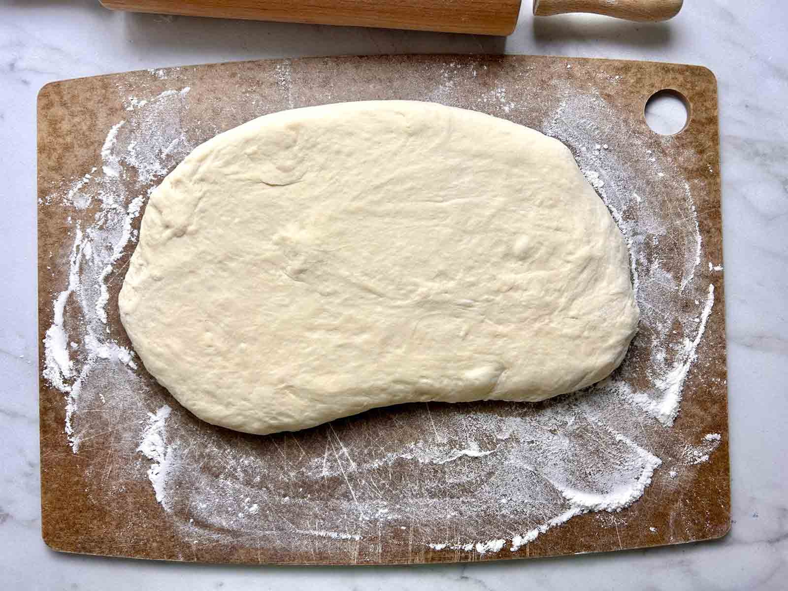 dough rolled out on floured cutting board.
