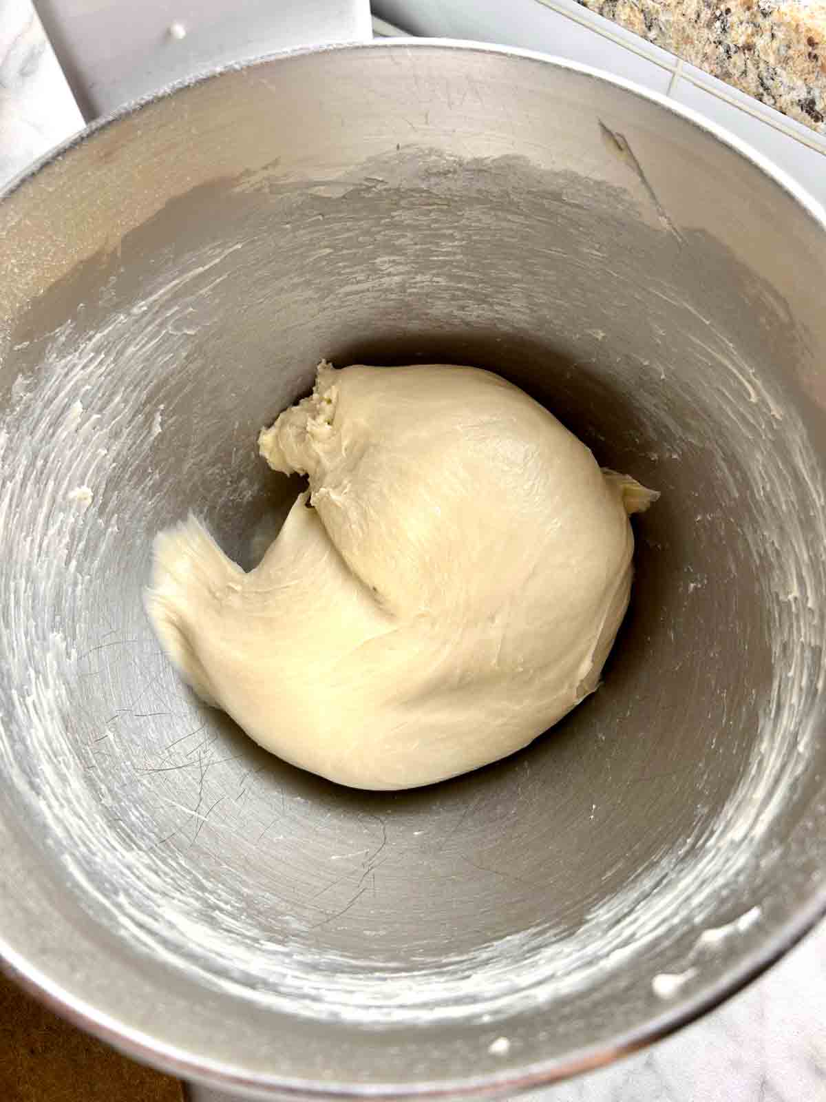 dough kneaded in stand mixer bowl until smooth.