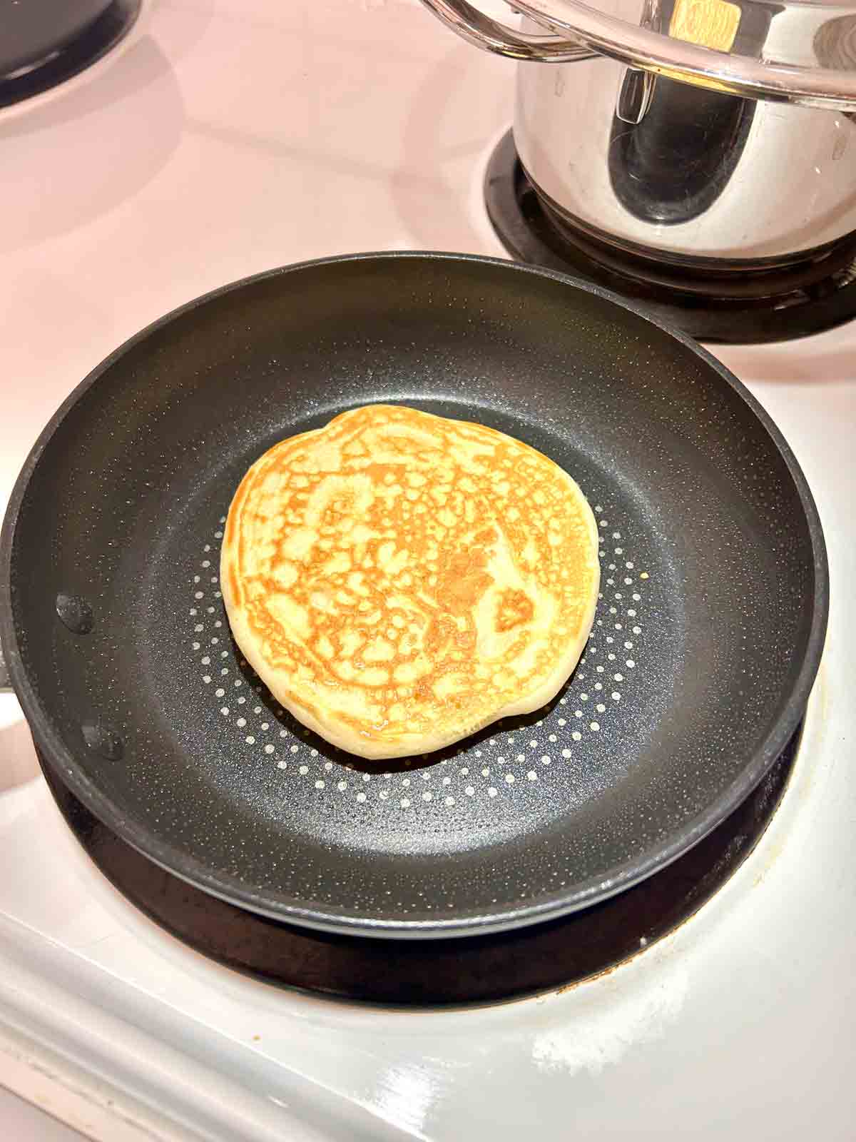 pancake flipped in pan.