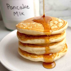 close up of stack of pancakes made with pancake mix.