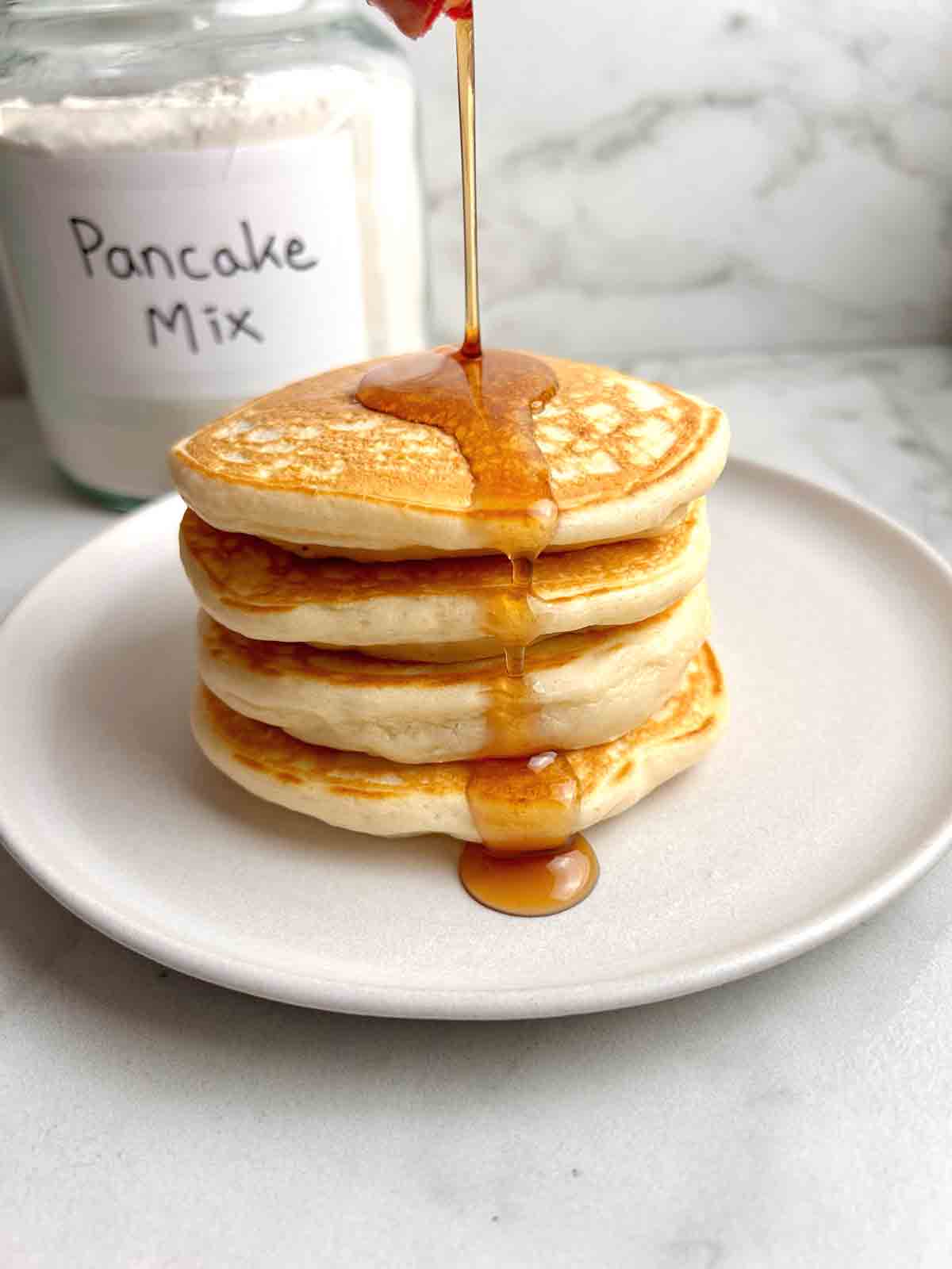 close up of stack of pancakes made with pancake mix.