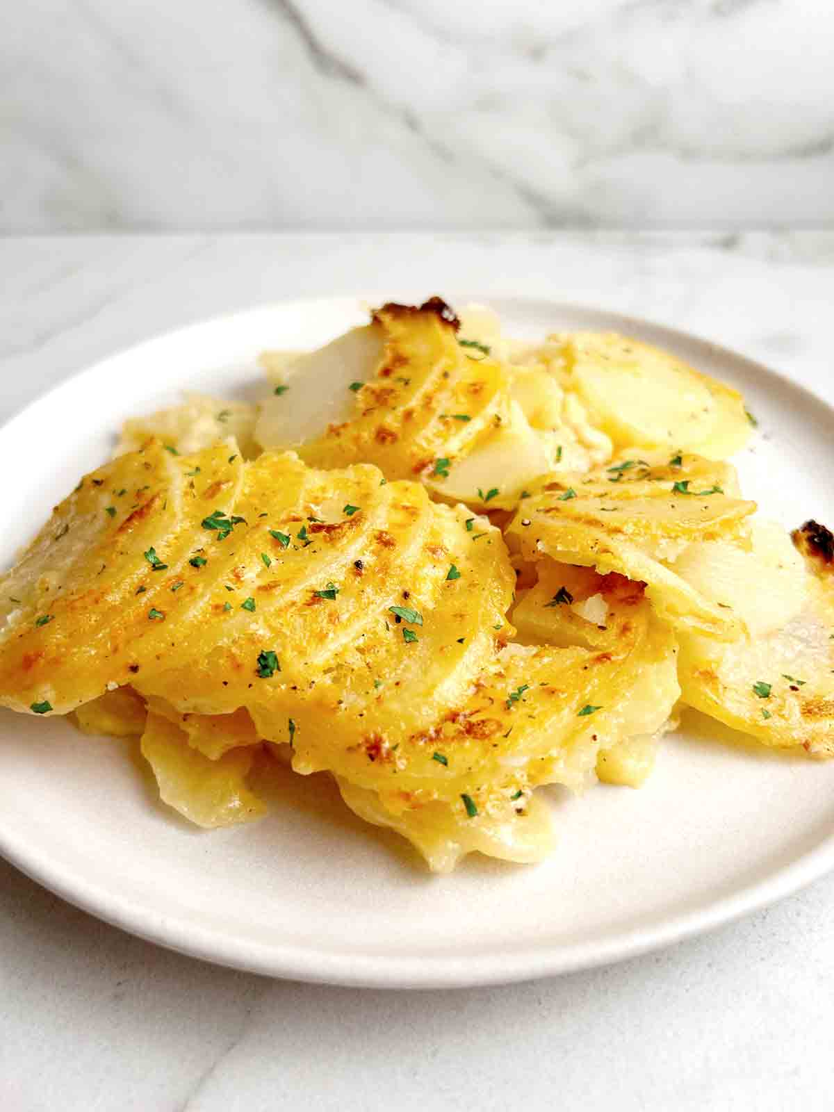 potatoes au gratin served on a plate.
