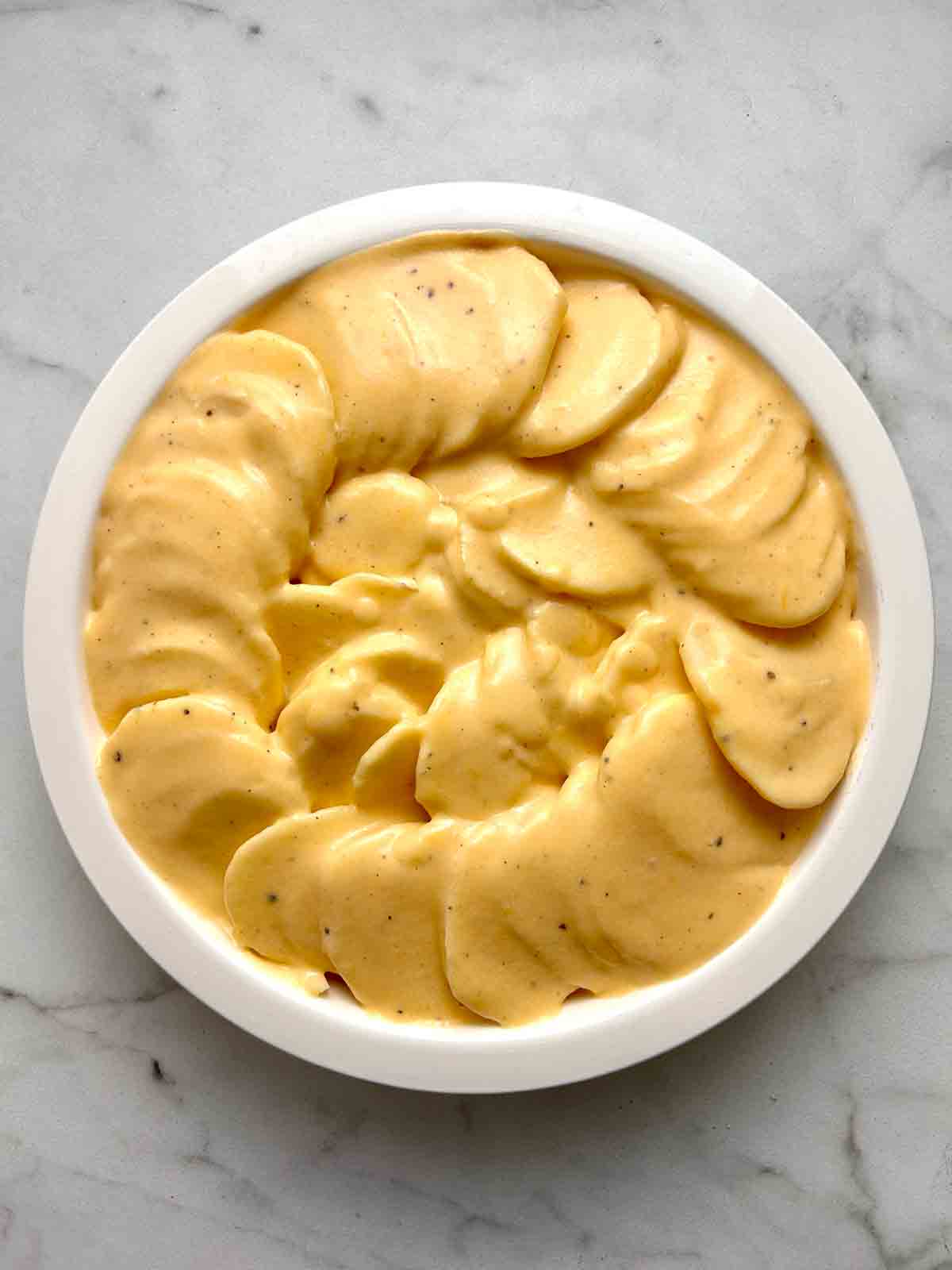 cheese sauce poured over potatoes.