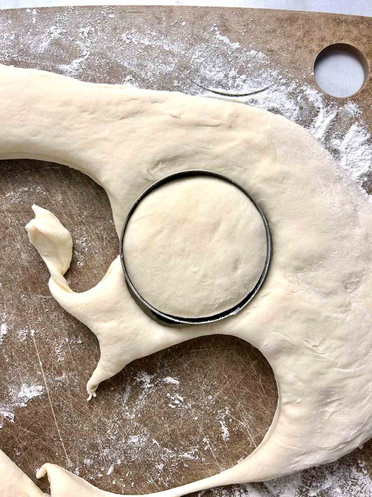 dough being cut into circles.