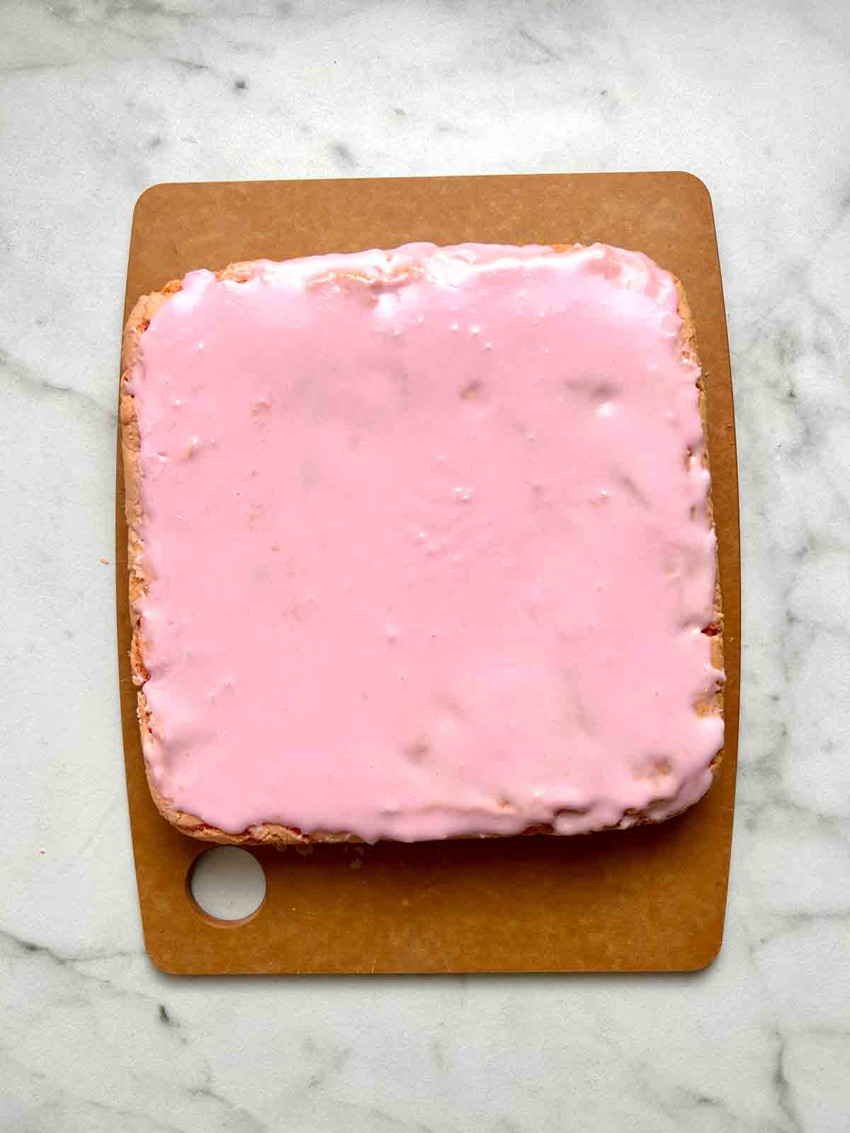 strawberry glaze applied to top of brownies.