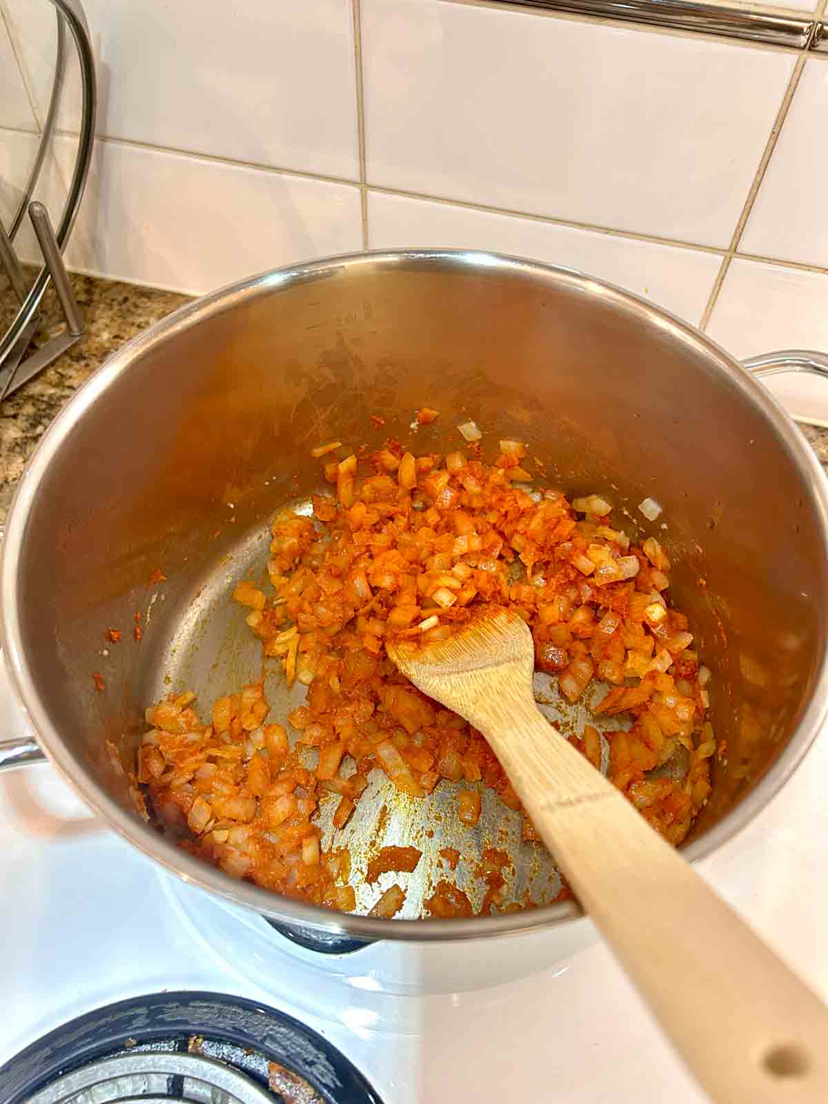 curry paste stirred into onions.