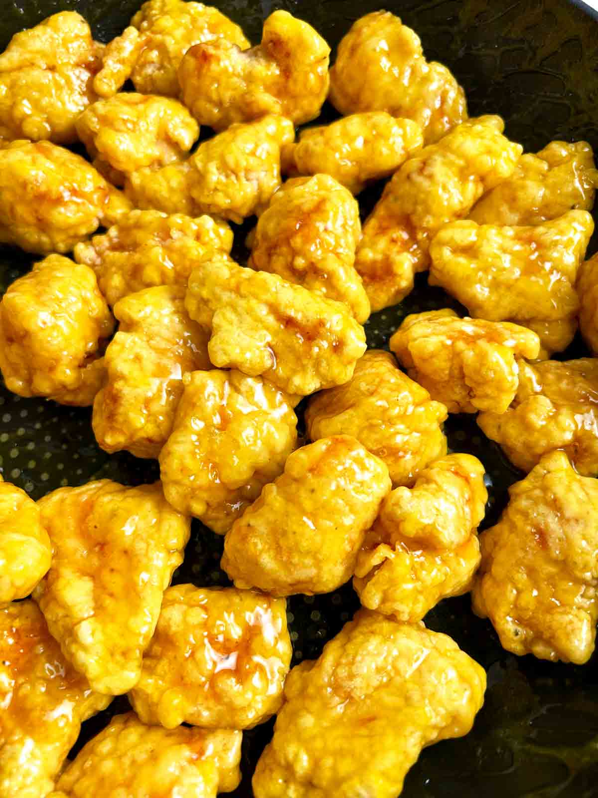 close up of lemon chicken in pan.