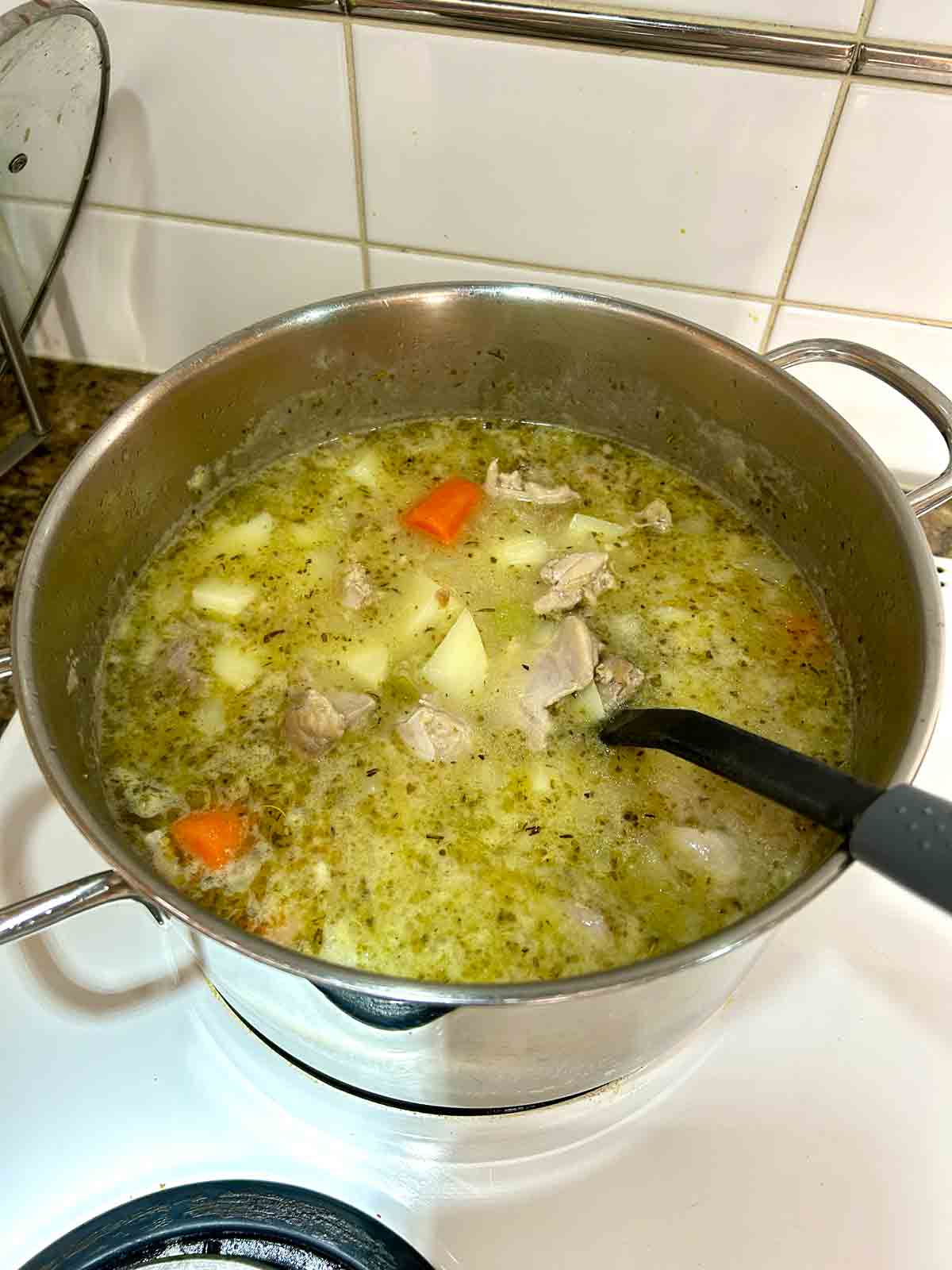 chicken broth, potatoes, and chicken added to pot.