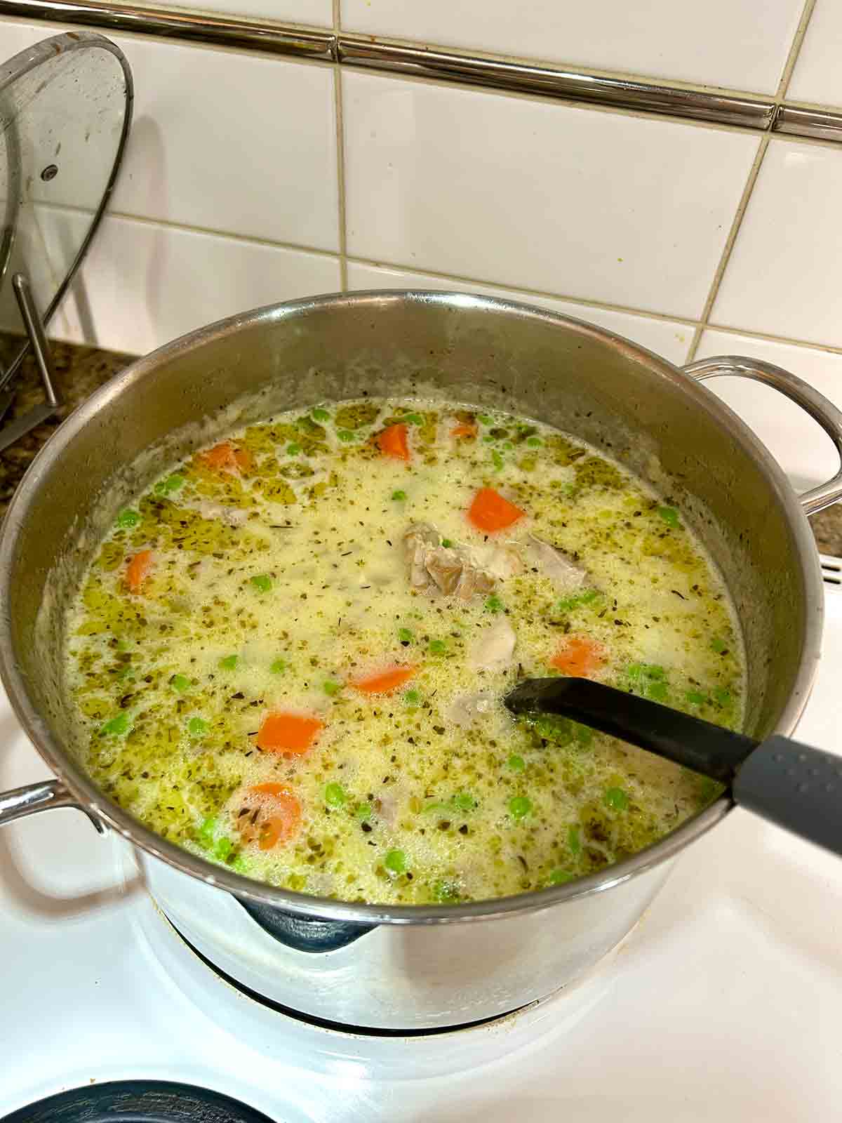 cream and peas stirred into soup.