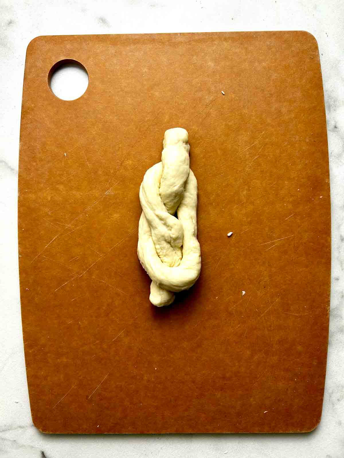 dough shaped into knot.